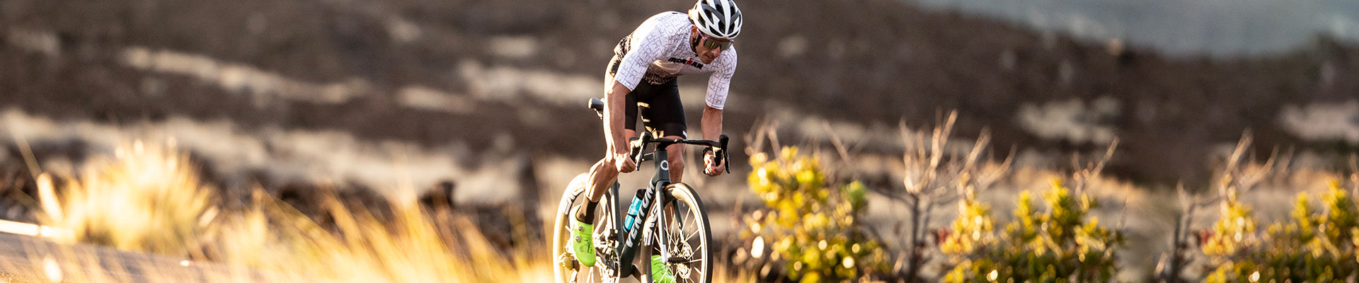 Man biking in Zoot cycle jersey and bib
