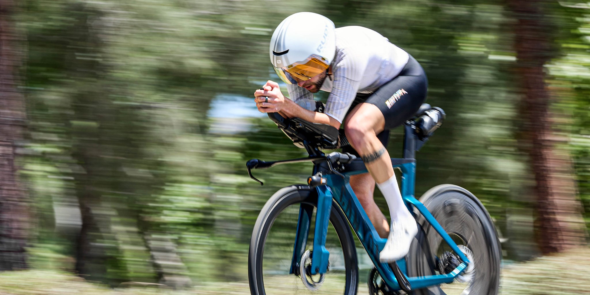 Person riding a bicycle on a blurred natural background