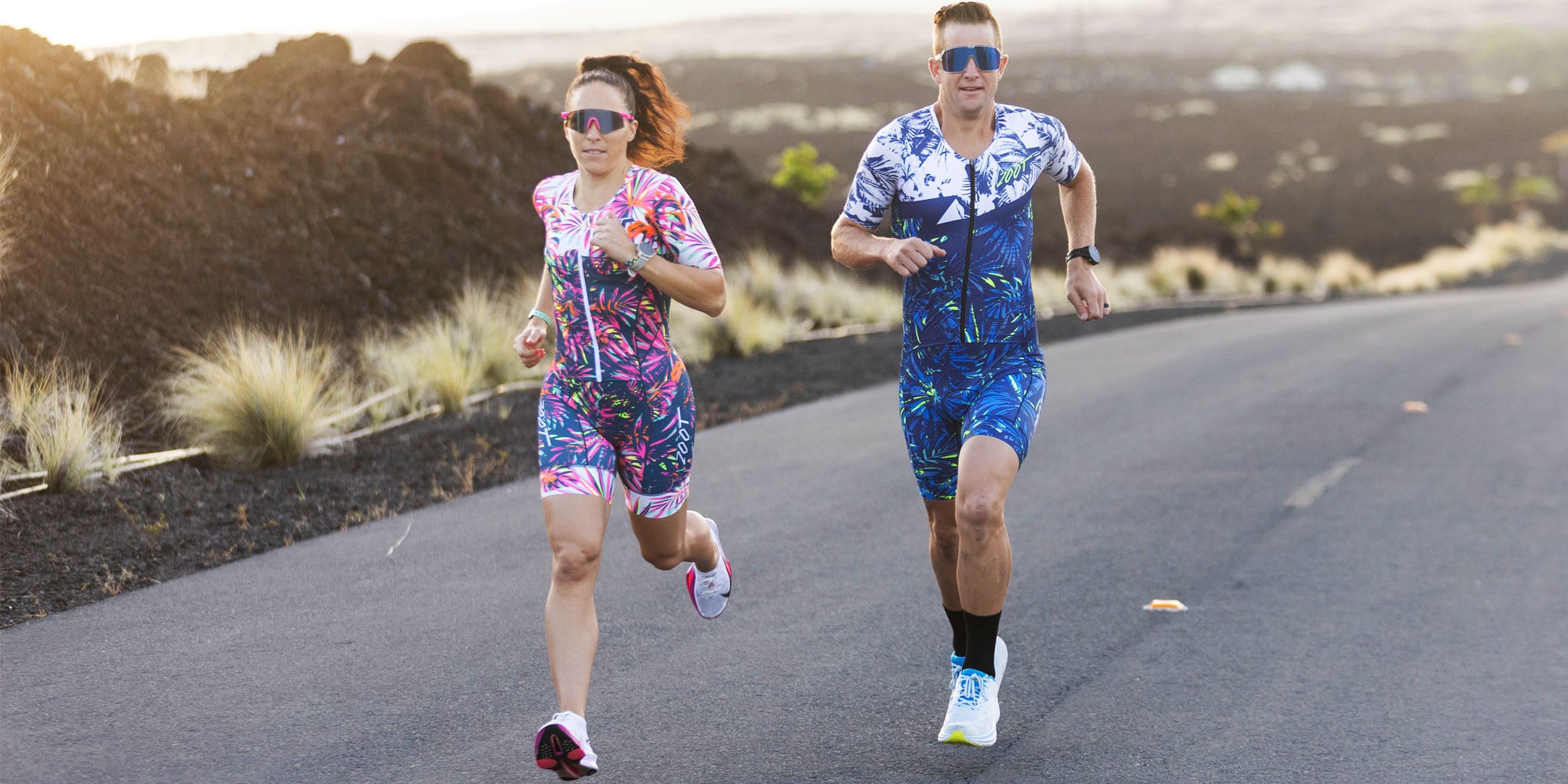 Female and Male running in triathlon kits in kona, hawaii