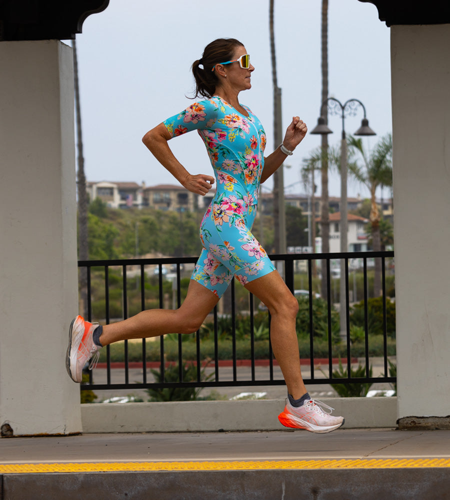 Female athlete running in triathlon racesuit