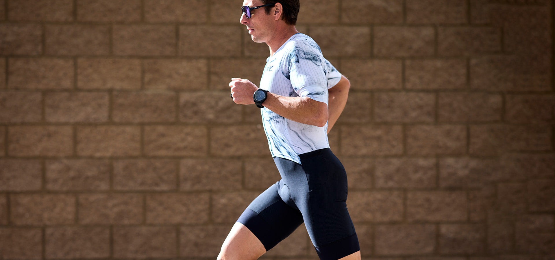 Male running in Elite Racesuit