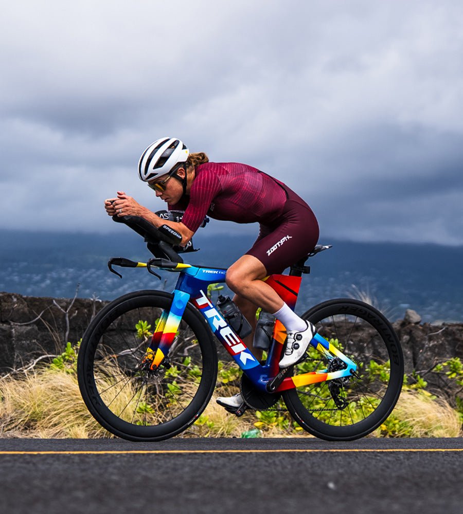 Holly Lawrence biking in the P1x racesuit